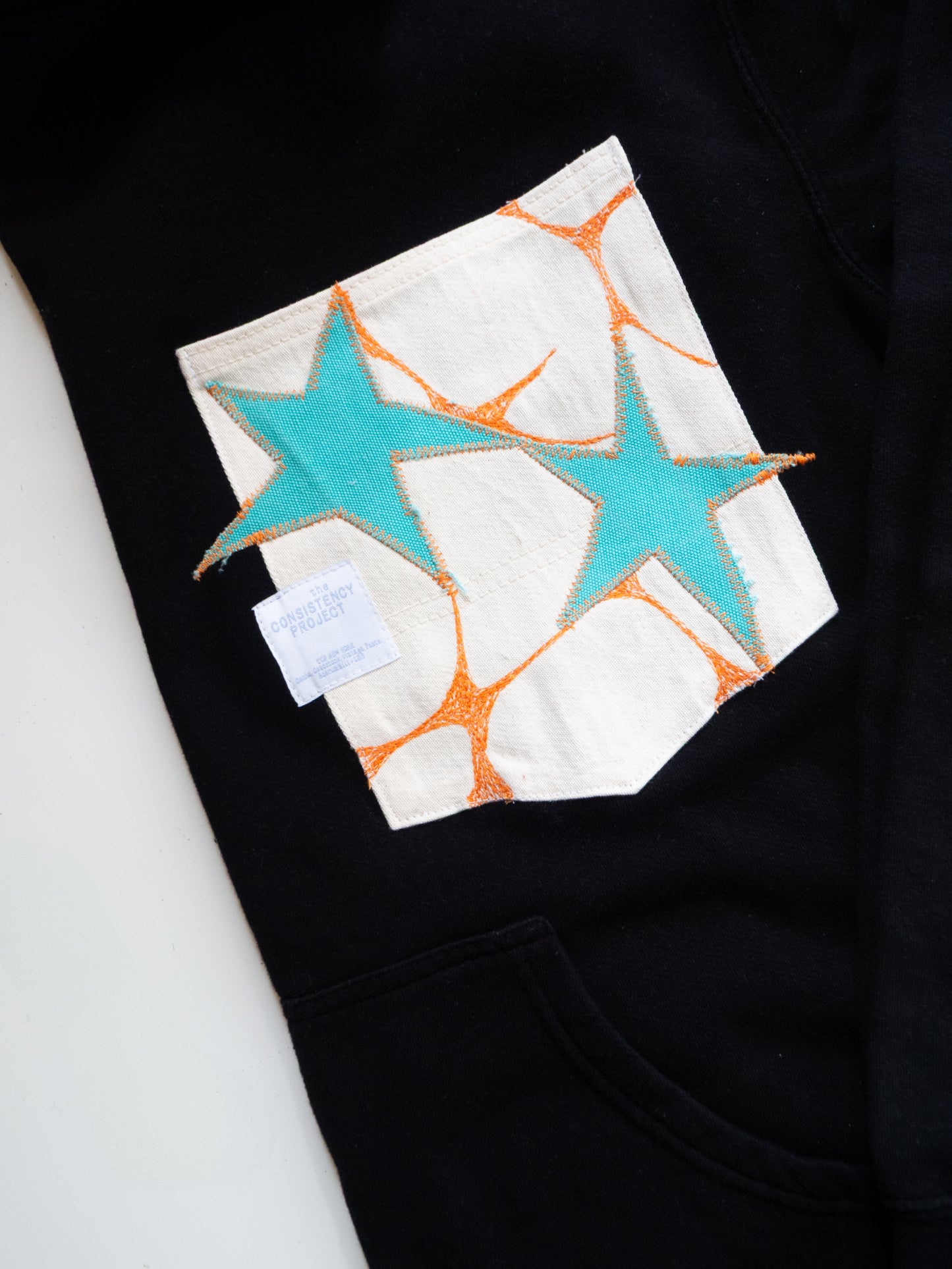 Reworked Pocket Hoodie (Size XL) - Turquoise Stars with Orange Details